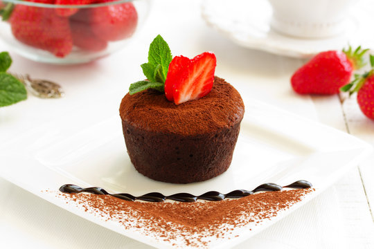 chocolate pudding with fudge center with strawberries,