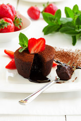 chocolate pudding with fudge center with strawberries,