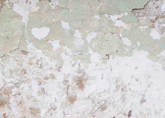 old green earthen wall with peeling paint