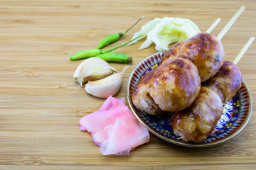 Thai style grilled sausage with side dishes
