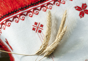 spikelets wheat on the embroidered towel