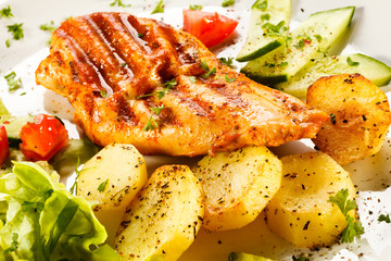 Grilled chicken fillet, boiled potatoes and vegetable salad 