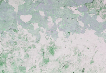 old green earthen wall with peeling paint