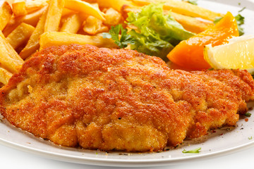 Pork chop, French fries and vegetables 