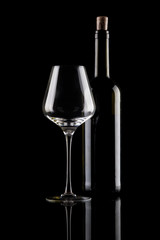 wine glass and bottle on black background