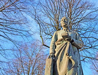 statue of the Flemish poet en priest Guido Gezelle, Bruges