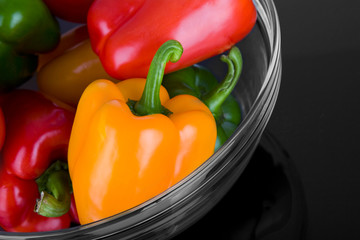 glass bowl with vegetable on black glass