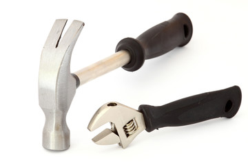 wrench and steel hammer with metal handle on a white background
