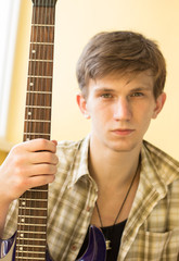 a young man with an electric guitar, guitar practice