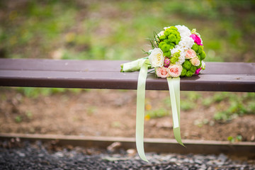 Wedding flower on a bench at park.