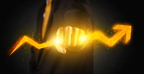 Business person holding a hot glowing upright arrow