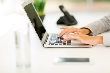 female hands working on laptop