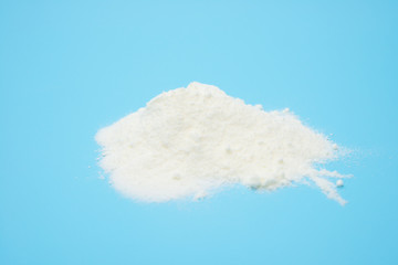 powdered milk on blue background