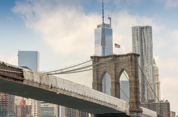Brooklyn Bridge surrounded by Manhattan skyscrapers