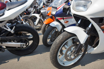 Fototapeta na wymiar motorcycles on parking on asphalt