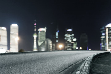 Empty floor with defocused modern buildings