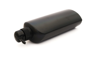 Fototapeta premium black plastic pump cosmetic bottle on white background
