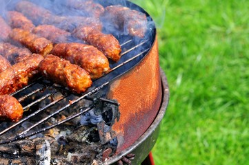 Close up of barbecue against green grass