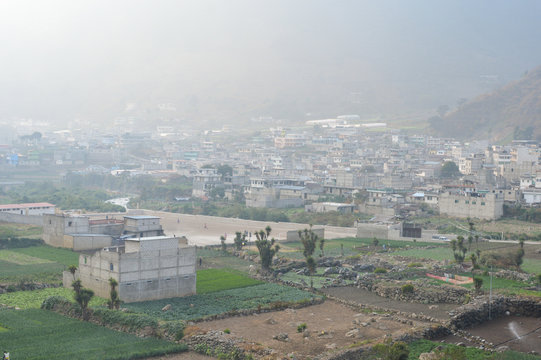 The mountain town of Zunil covered with fog