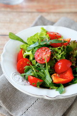 Fresh salad with tomatoes and arugula