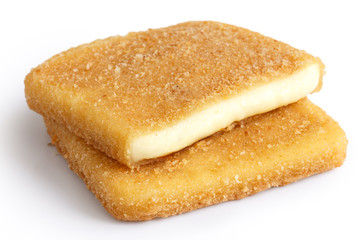 Square golden fried cheeses isolated, cut and melting.