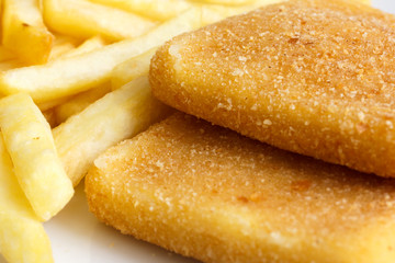 Detail of golden fried cheese, with chips.