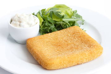 Plate of fried cheese, chips, tartar sauce, salad.