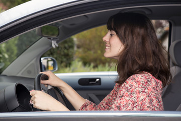 young woman sitting in a car