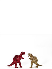 Dinosaurs in red and gold glitter on white. Portrait.