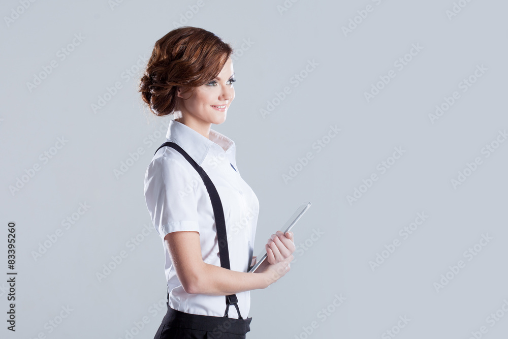 Wall mural Successful business woman, with laptop in hand, place for text