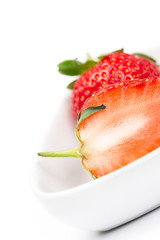 Closeup of a halved fresh ripe strawberry