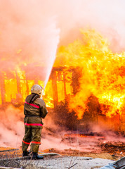 Fireman extinguishes a fire