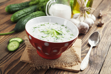 Summer soup with cucumbers, yogurt and fresh herbs