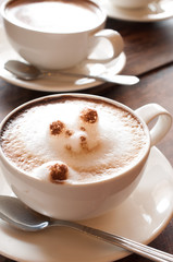 Latte' Art Coffee,Cup of latte coffee on wooden background
