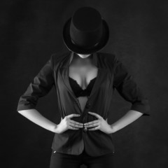 Sexy cabaret dancer on the dark background