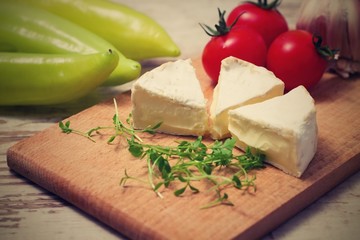 Vintage retro photo of three camembert portions