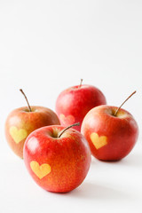 Red apples with a heart symbol