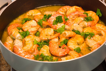 Shrimp cooking with parsley