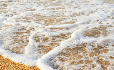 Wave of the sea on the sand beach/ Close up image 