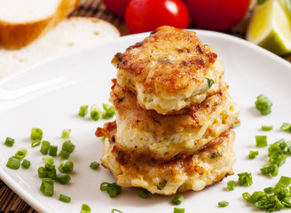 Homemade chicken cutlets sprinkled with green onion, selective f
