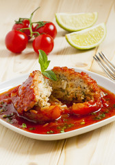 Bell peppers stuffed with meat, rice  and sauce on plate, select