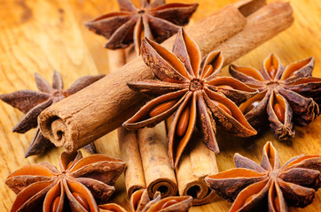 cinnamon and anise on the wooden background