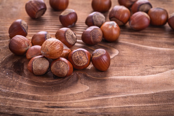 hazelnuts on  vintage  wooden board food and drink concept