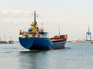 The cargoship leaves harbor