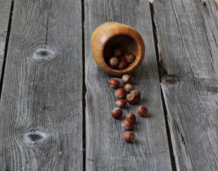 Wood nut in a wooden bowl on a wooden background