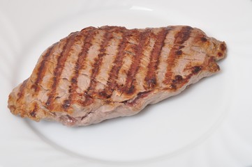 Grilled beef steak on plate