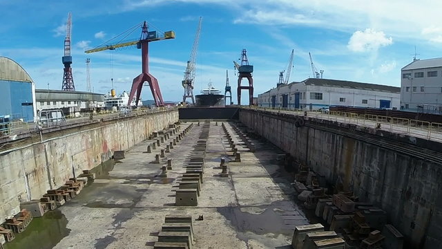 A large cargo ship is being renovated in shipyard  Portugal