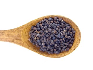 Black pepper on wooden spoon