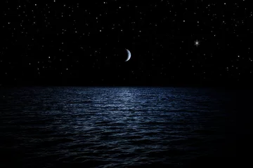 Fotobehang Nacht Sterrenhemel boven de zee