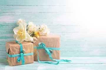 Festive gift boxes with ribbon and flowers